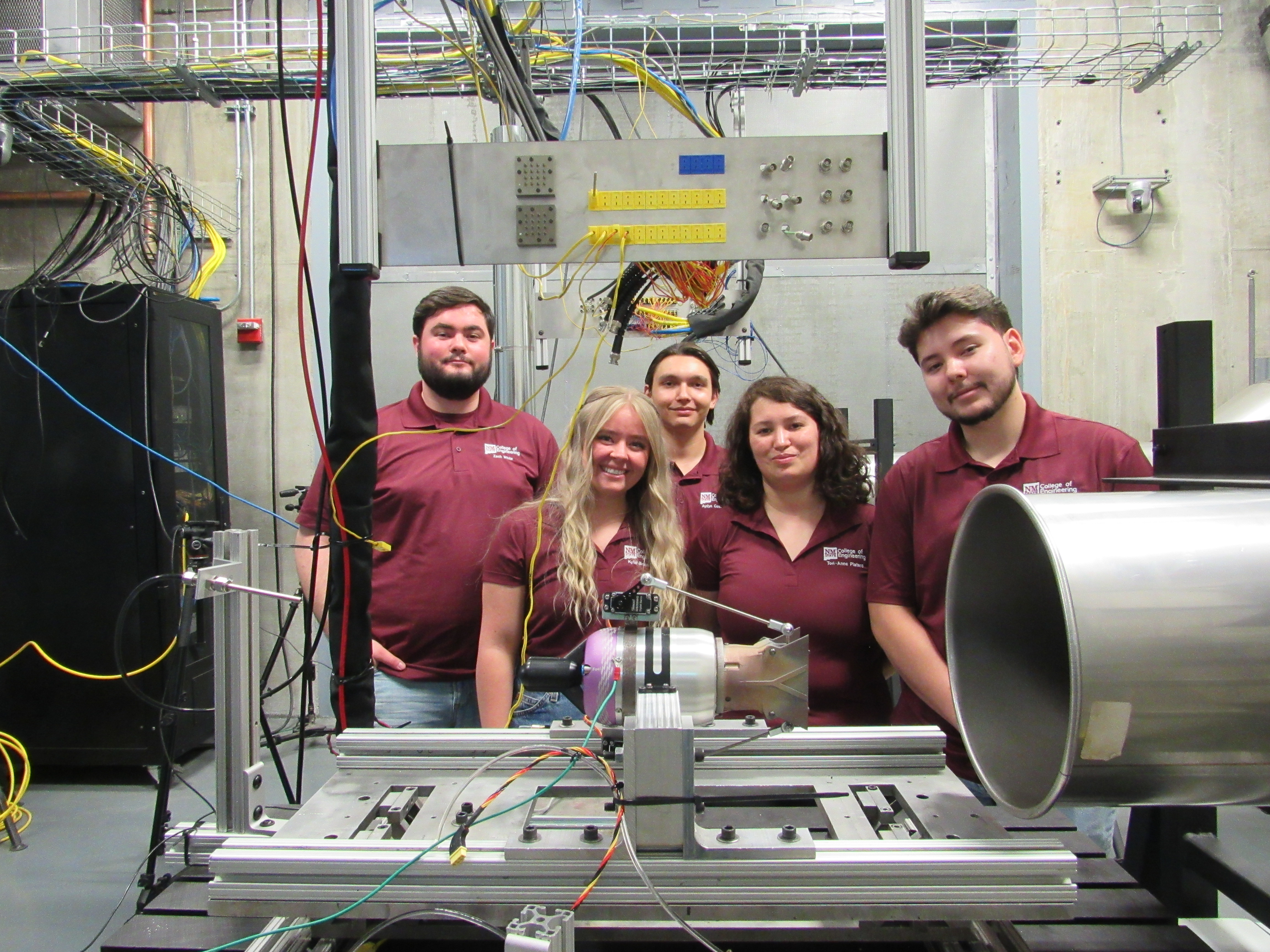 group photo, all wearing crimson colored polos